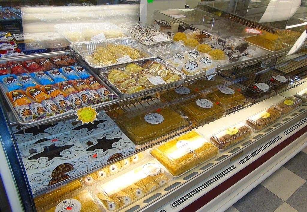 Bakery display case with cakes, pastries and desserts at Kalinka Euro Market